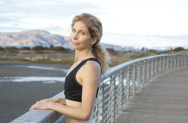 Caucasian woman standing on footbridge