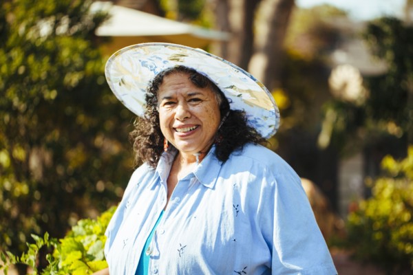 Hispanic woman smiling in backyard