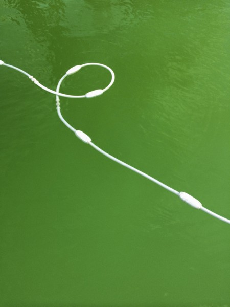 High angle view of buoy cord in lake