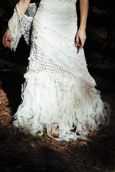 Bride wearing wedding gown in garden