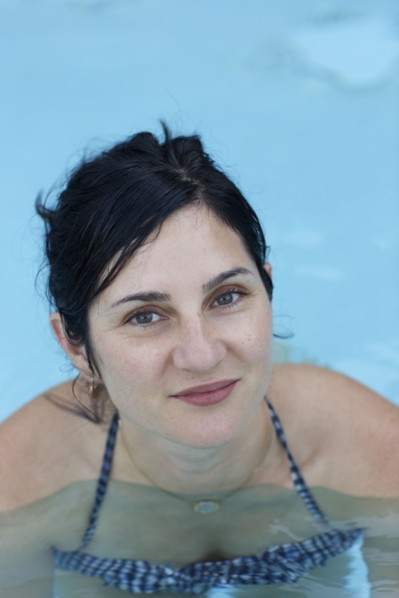 Smiling woman swimming in pool