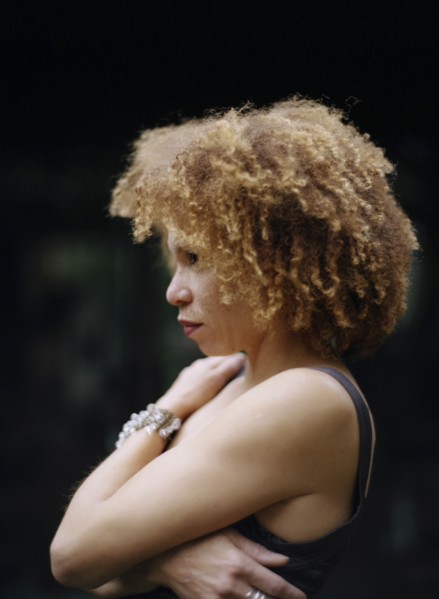 Close up of woman hugging her chest