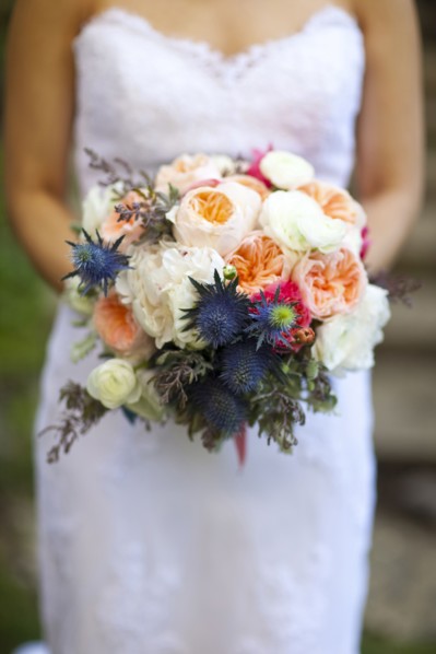 Close up of bride holding bouquet of flowers
