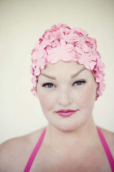 Woman wearing swim cap and bathing suit