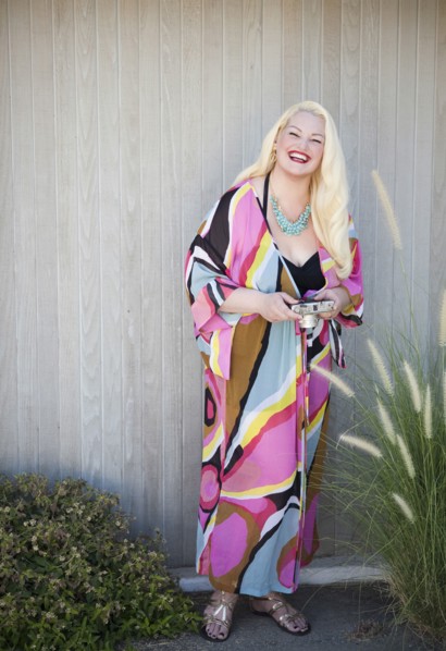 Woman wearing cover-up near fence