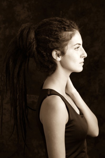 Close up profile of serious woman with dreadlocks