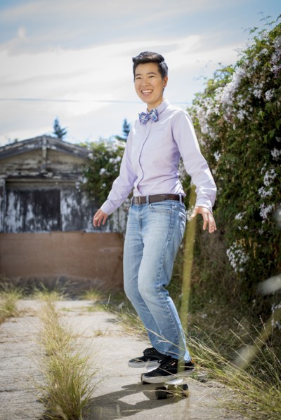 Androgynous woman riding skateboard