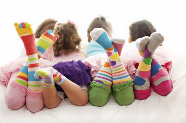 Rear view of girls wearing colorful socks