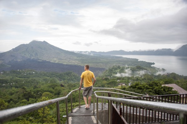 Caucasian tourist admiring scenic view of jungle