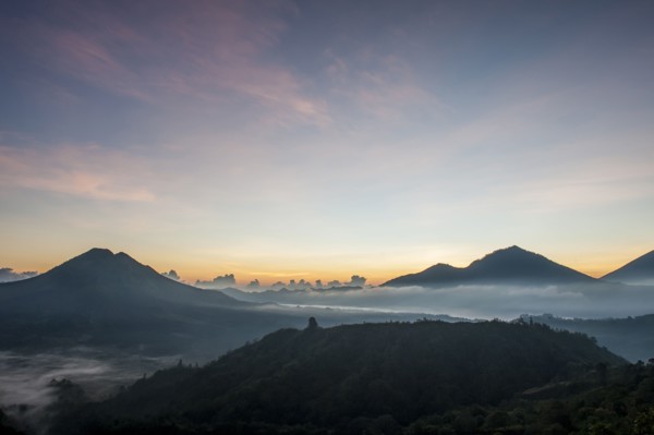 Hilltops over morning fog in remote landscape