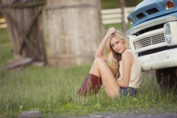Caucasian woman sitting near truck
