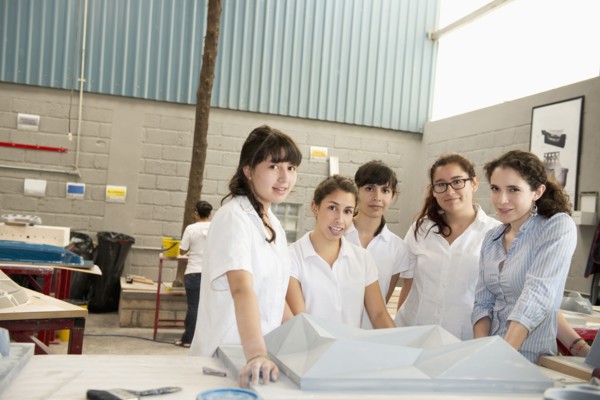 Workers talking in manufacturing plant