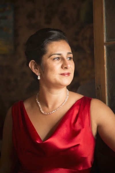Hispanic woman wearing evening gown