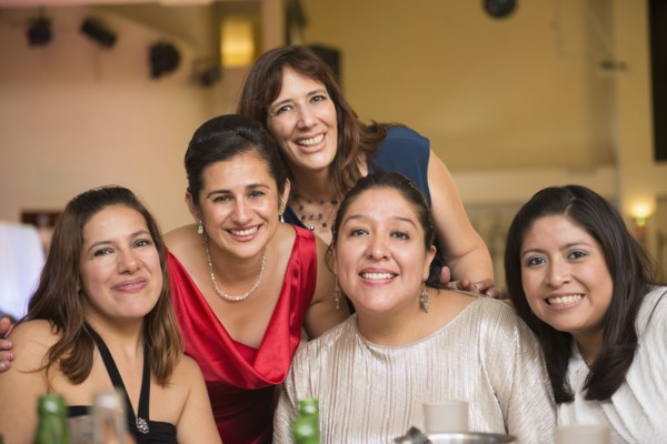 Hispanic family smiling at wedding reception