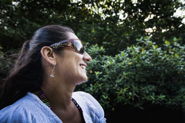 Hispanic woman smiling outdoors