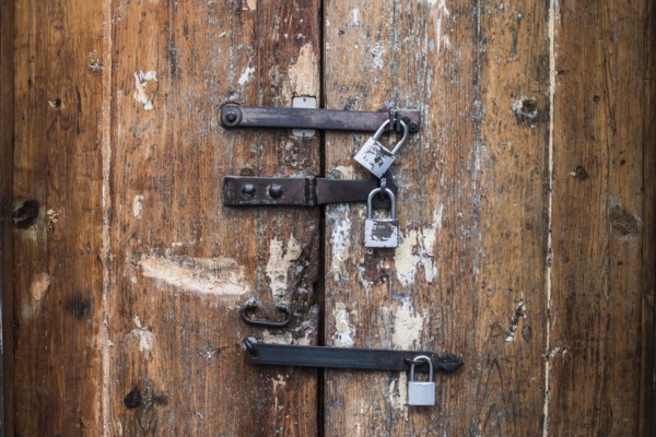 Close up of padlocks on secure door