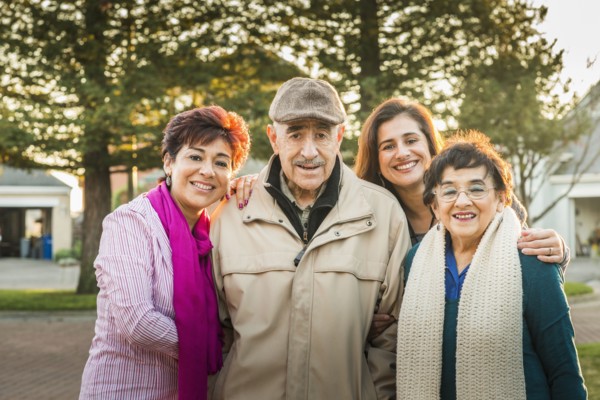 Hispanic Multi-generation family smiling outdoors