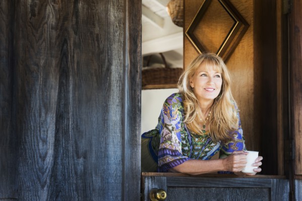Caucasian woman smiling in doorway