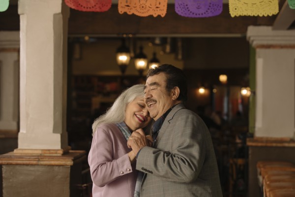 Older couple dancing in restaurant