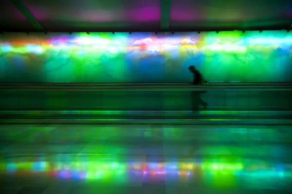 Silhouette of person on moving walkway
