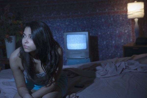 Hispanic woman having trouble sleeping