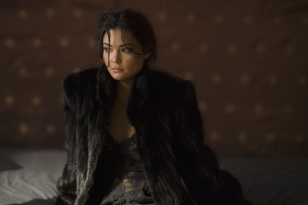 Serious Hispanic woman in fur coat