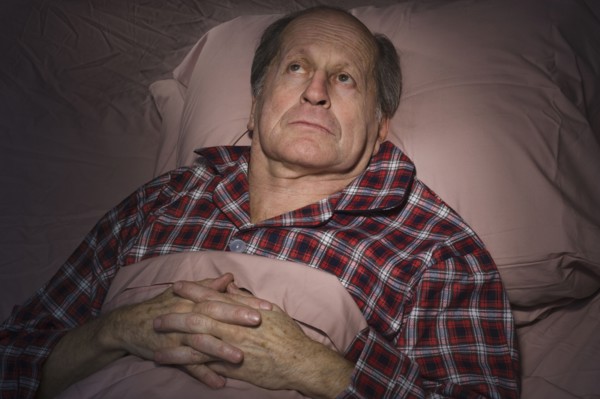 Senior Caucasian man having trouble sleeping