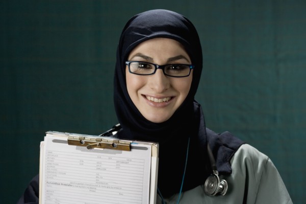 Middle Eastern doctor holding medical chart