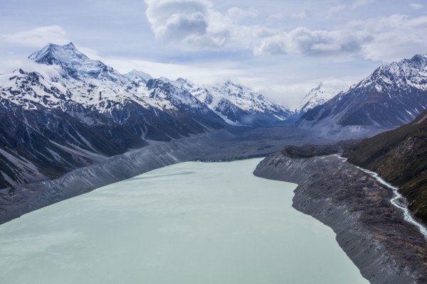 Remote mountains over frozen lake