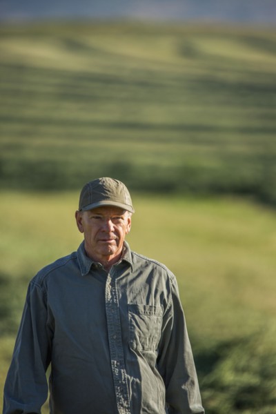 Caucasian farmer standing in field