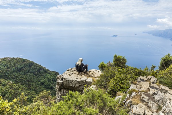 Caucasian woman admiring scenic view of ocean