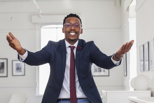 Black man gesturing in gallery