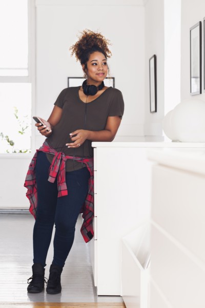 Mixed race woman holding cell phone