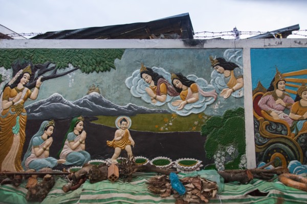 Mural of Buddhist figures painted on wall