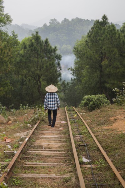 Woman walking on steps on rural hillside