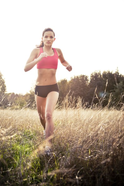 Jogger running through field