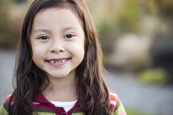 Mixed race girl smiling outdoors