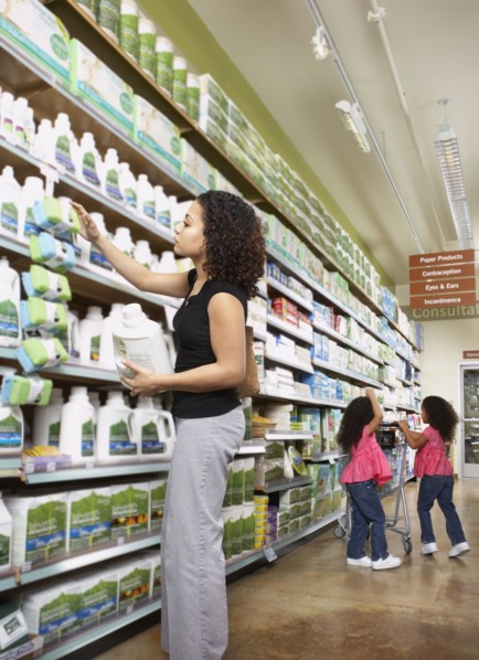Mother with young daughters in grocery store