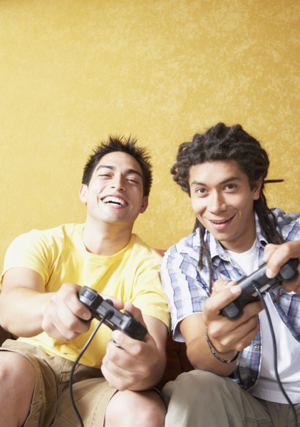 Two Hispanic men playing video games