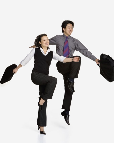 Studio shot of Asian businesspeople skipping