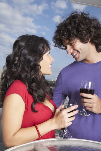 Hispanic couple smiling at each other
