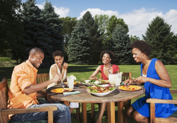 African American friends eating outdoors