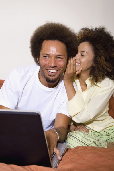 African couple telling secret
