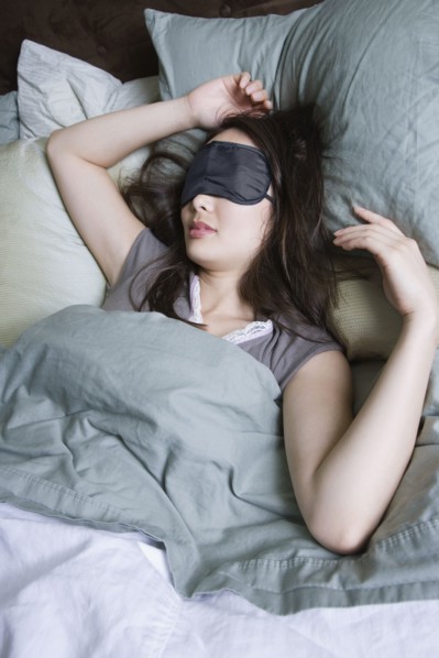 Woman sleeping with eye mask