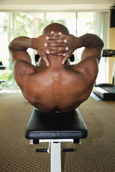 African man doing sit-ups