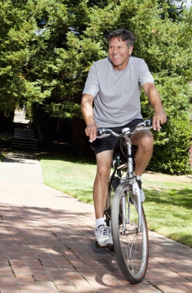 Caucasian man riding bicycle