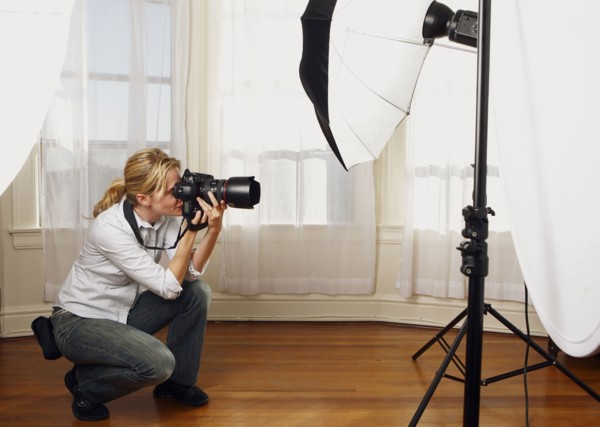 Caucasian photographer working in studio
