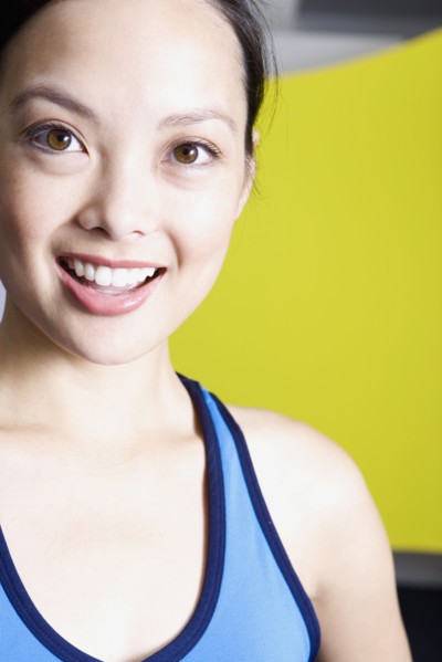 Filipino woman smiling in gym