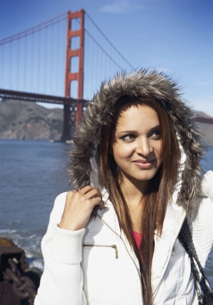 Mixed race woman standing in front of Golden Gate Bridge