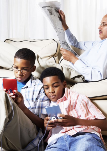 Mixed race boys playing video games